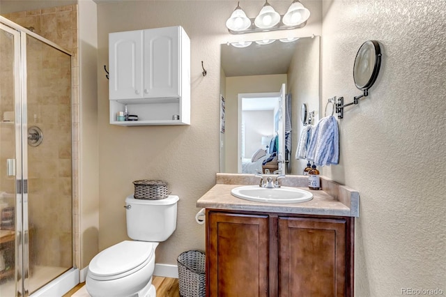 21658 E Tallkid Ave, Parker, CO 80138 - full bathroom with a stall shower, vanity, and a textured wall