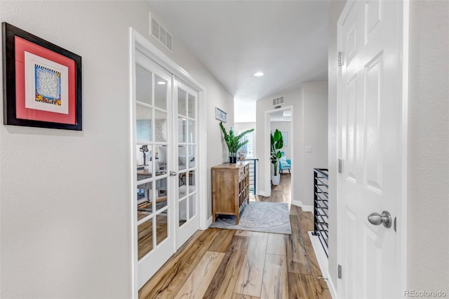 21658 E Tallkid Ave, Parker, CO 80138 - corridor with french doors, light wood-style floors, and recessed lighting