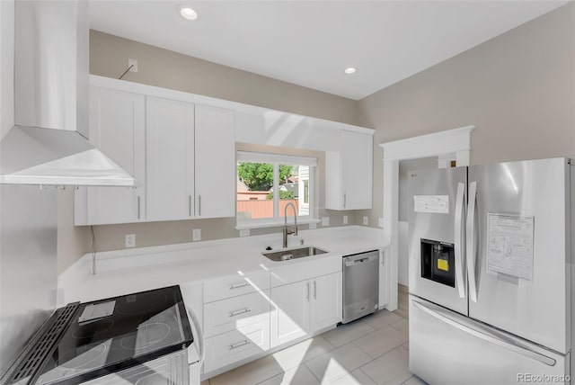 2323 W Pikes Peak Ave, Colorado Springs, CO 80904 - kitchen featuring stainless steel appliances, wall chimney range hood, white cabinets, light countertops, and recessed lighting