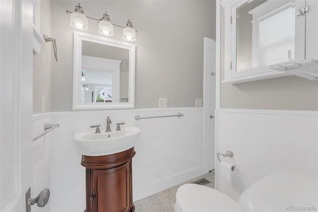 2323 W Pikes Peak Ave, Colorado Springs, CO 80904 - bathroom with vanity and wainscoting