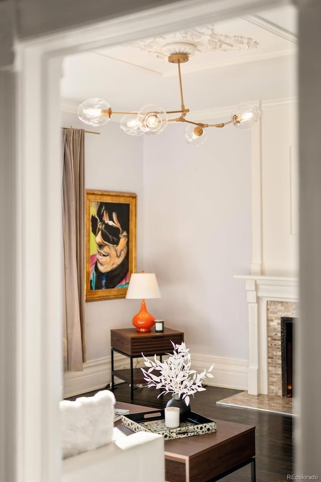 interior details with a fireplace and baseboards