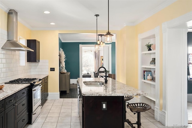 kitchen with light tile patterned floors, a sink, gas range, and extractor fan