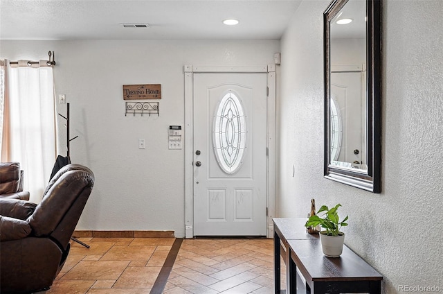 1419 Swan Ave, Brighton, CO 80601 - entrance foyer with a textured wall and recessed lighting