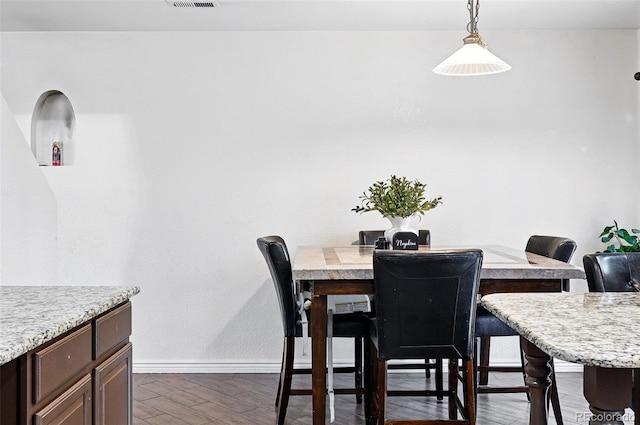 1419 Swan Ave, Brighton, CO 80601 - dining area with wood finished floors and baseboards