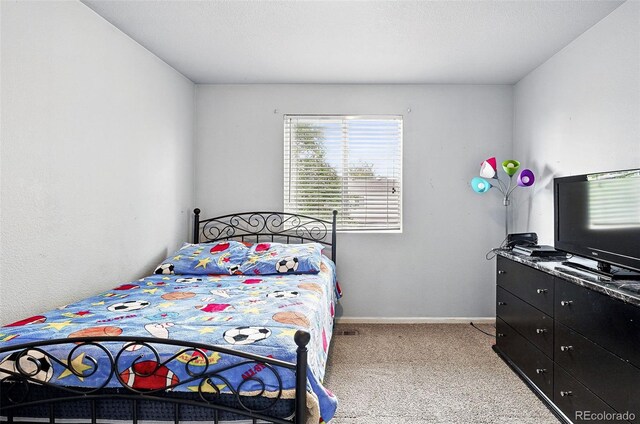 1419 Swan Ave, Brighton, CO 80601 - carpeted bedroom with baseboards
