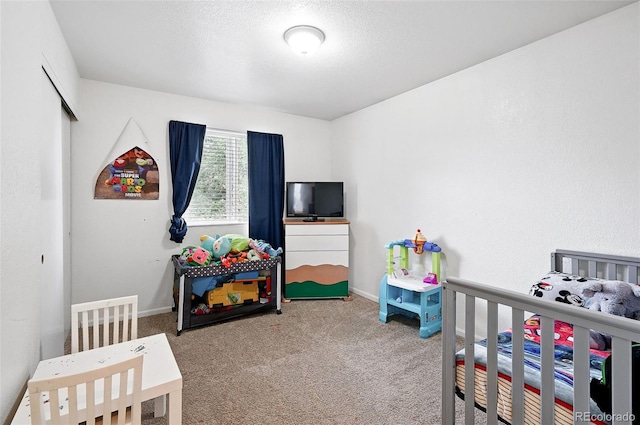 1419 Swan Ave, Brighton, CO 80601 - bedroom with carpet, a textured ceiling, and baseboards