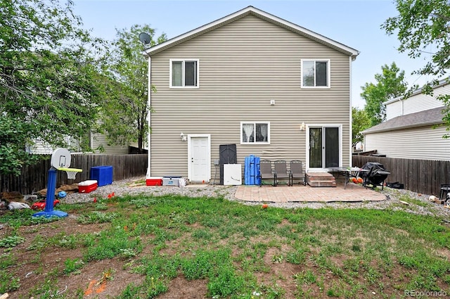1419 Swan Ave, Brighton, CO 80601 - rear view of property featuring a patio and entry steps