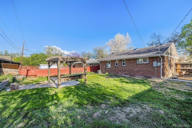 view of yard featuring a pergola and central air condition unit