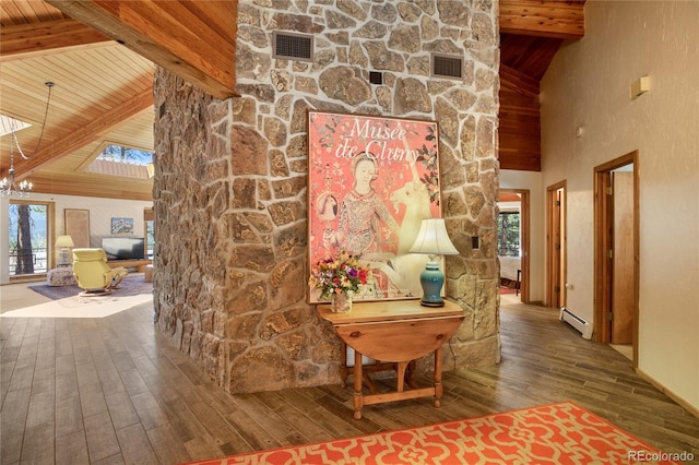 1000 Ponderosa Way, Woodland Park, CO 80863 - hall with a baseboard radiator, hardwood / wood-style floors, a wooden ceiling with exposed beams, high vaulted ceiling, and a chandelier
