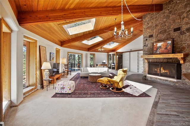 1000 Ponderosa Way, Woodland Park, CO 80863 - living area with plenty of natural light, a chandelier, a fireplace, a skylight, and wood ceiling