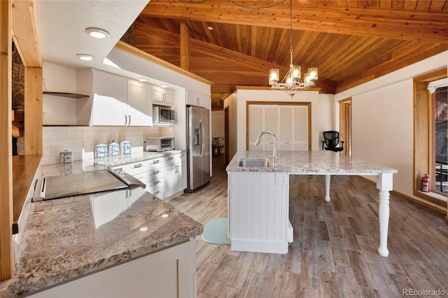 1000 Ponderosa Way, Woodland Park, CO 80863 - kitchen with stainless steel appliances, open shelves, wood ceiling, backsplash, and a chandelier