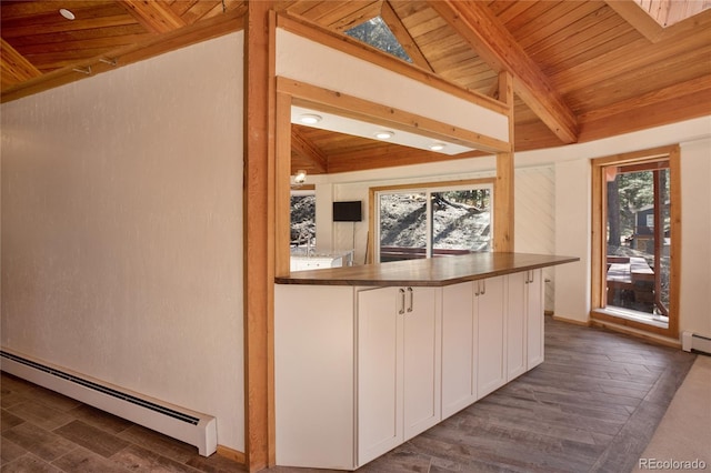 1000 Ponderosa Way, Woodland Park, CO 80863 - kitchen with baseboard heating, wood ceiling, white cabinetry, dark wood-style flooring, and recessed lighting