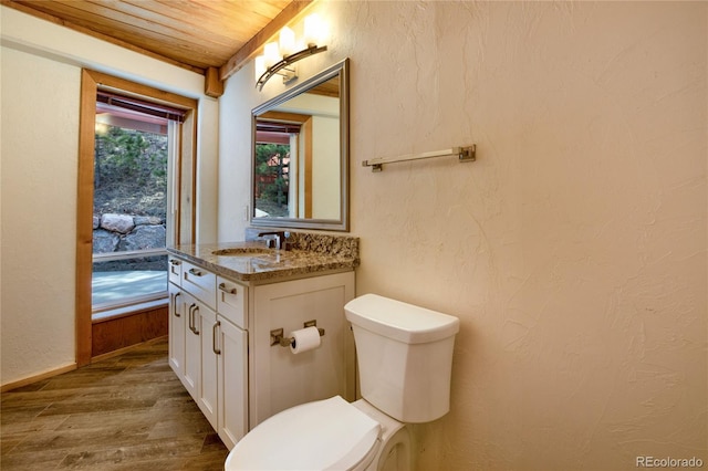 1000 Ponderosa Way, Woodland Park, CO 80863 - bathroom with wood finished floors, vanity, and wood ceiling