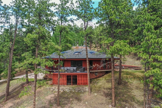 1000 Ponderosa Way, Woodland Park, CO 80863 - back of property featuring a wooden deck