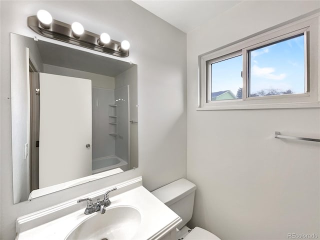 full bathroom with vanity, toilet, and  shower combination