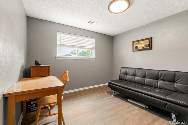 16259 W 10th Ave Unit L2, Golden, CO 80401 - office area featuring light wood-style floors and a textured ceiling