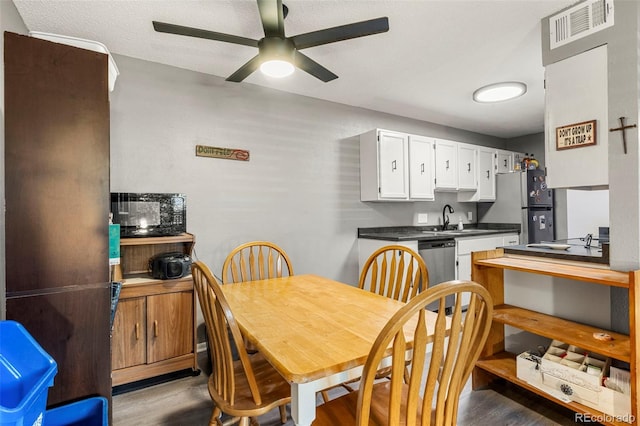 16259 W 10th Ave Unit L2, Golden, CO 80401 - dining area featuring wood finished floors and a ceiling fan