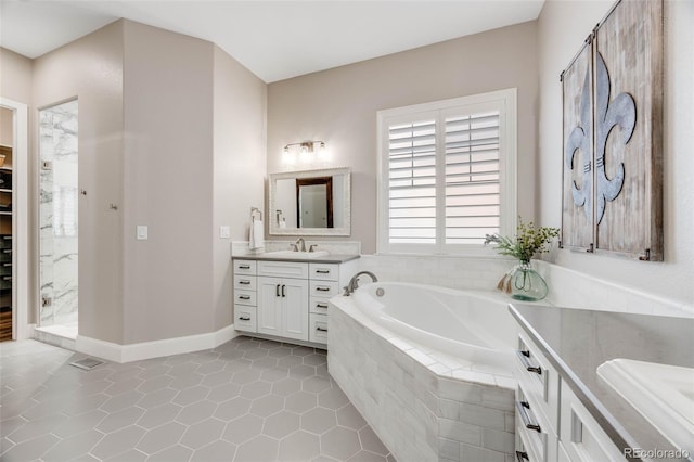 360 Basilwood Way, Highlands Ranch, CO 80126 - full bathroom featuring vanity, tile patterned flooring, and a garden tub