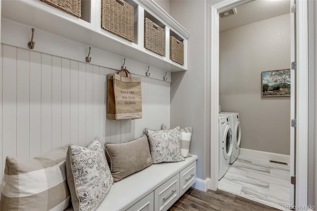 360 Basilwood Way, Highlands Ranch, CO 80126 - mudroom with washer and clothes dryer and dark marble finish flooring