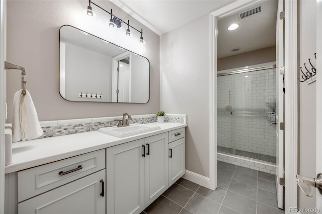 360 Basilwood Way, Highlands Ranch, CO 80126 - full bathroom with vanity, a shower stall, tile patterned flooring, and tasteful backsplash