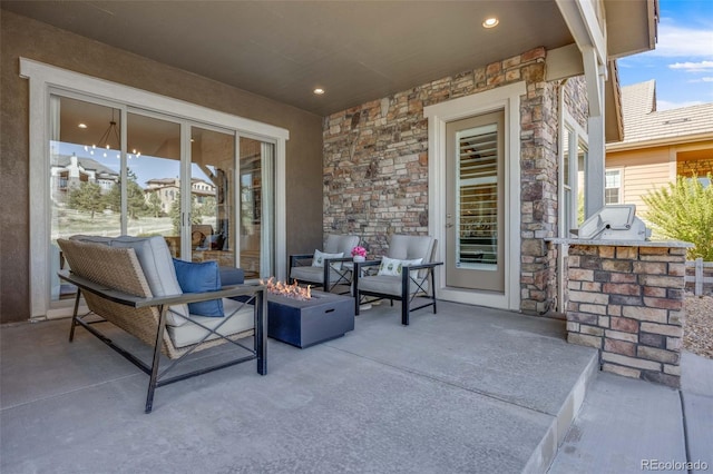 360 Basilwood Way, Highlands Ranch, CO 80126 - view of patio featuring an outdoor living space with a fire pit