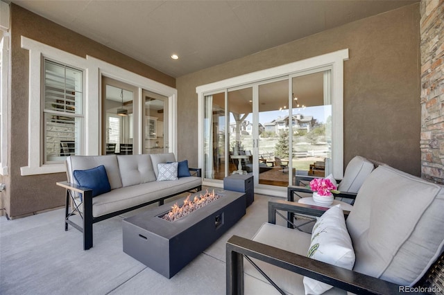 360 Basilwood Way, Highlands Ranch, CO 80126 - view of patio with an outdoor living space with a fire pit