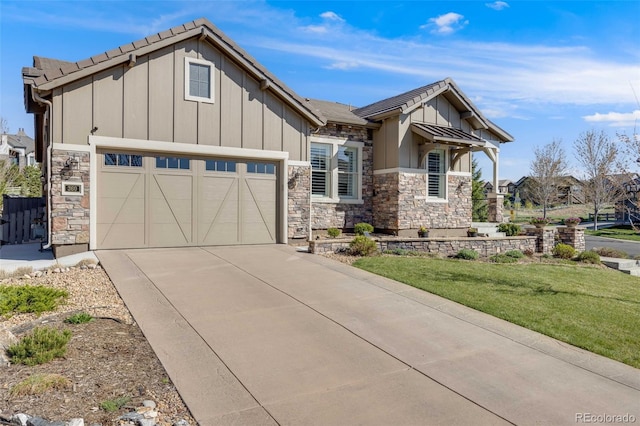 360 Basilwood Way, Highlands Ranch, CO 80126 - view of front of home with stone siding, board and batten siding, an attached garage, concrete driveway, and a front yard