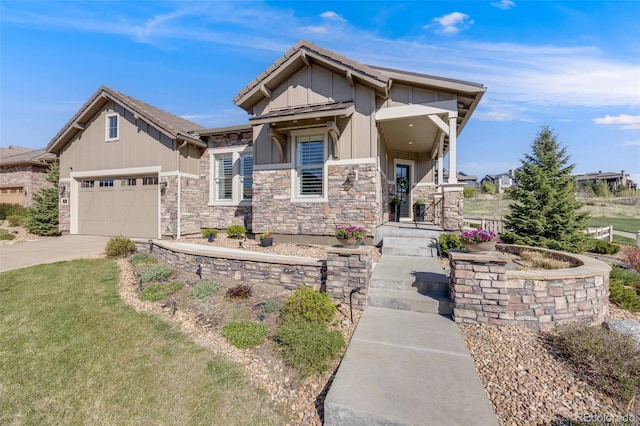 360 Basilwood Way, Highlands Ranch, CO 80126 - craftsman house with board and batten siding, stone siding, concrete driveway, an attached garage, and a front lawn