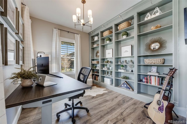 360 Basilwood Way, Highlands Ranch, CO 80126 - home office with wood finished floors and a chandelier