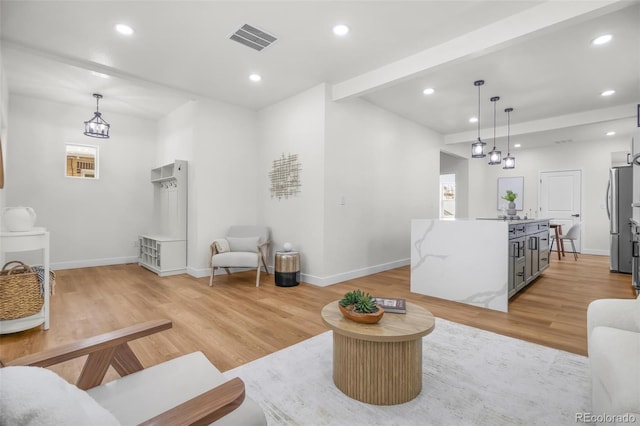 living room with light hardwood / wood-style flooring