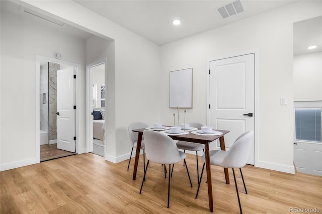 dining room with light hardwood / wood-style flooring