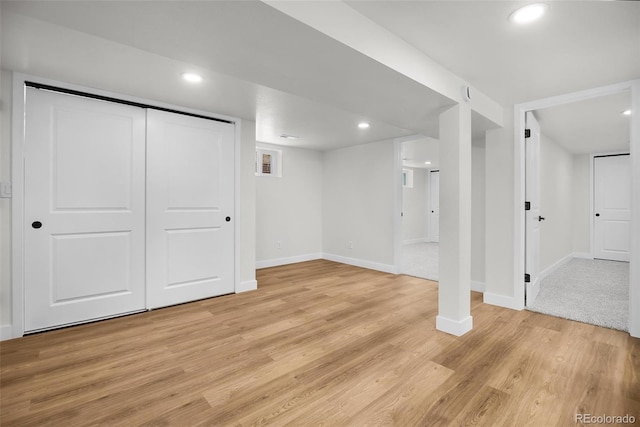 basement featuring light wood-type flooring