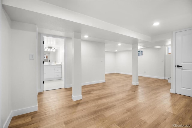 basement featuring light wood-type flooring