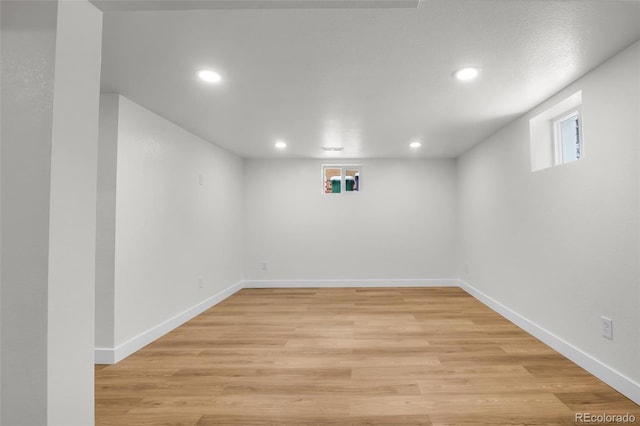 basement featuring light hardwood / wood-style flooring