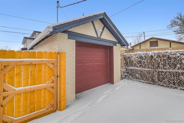 view of snow covered garage