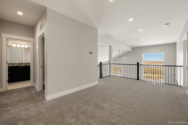 interior space with carpet and ceiling fan