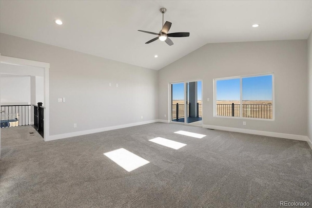 unfurnished room with ceiling fan, lofted ceiling, and carpet flooring