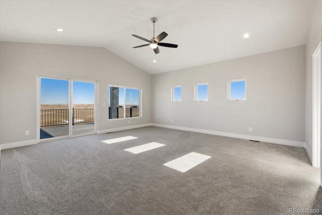 spare room with ceiling fan, lofted ceiling, and carpet