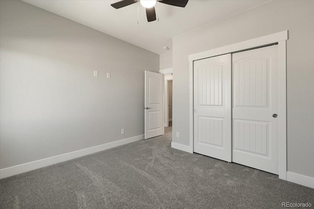 unfurnished bedroom with a closet, ceiling fan, and dark colored carpet