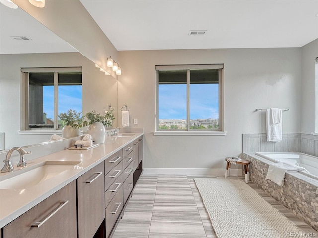 9395 Night Star Pl, Lone Tree, CO 80124 - bathroom with double vanity and a garden tub