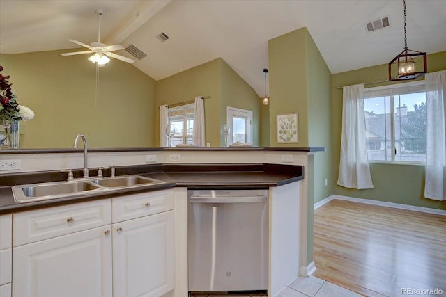 kitchen with lofted ceiling with beams, a sink, white cabinetry, dishwasher, and dark countertops