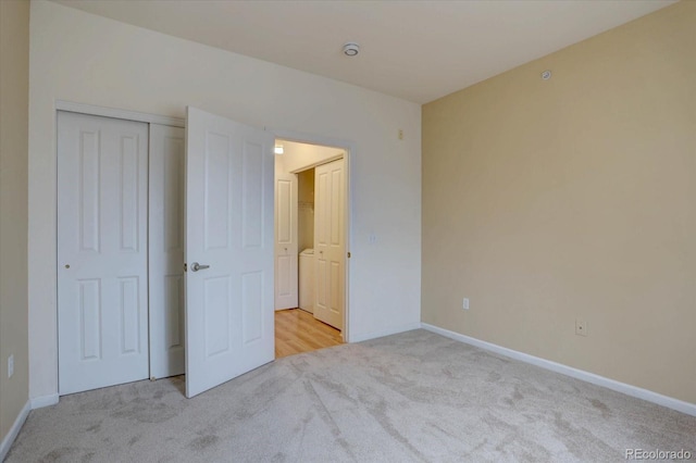 unfurnished bedroom featuring baseboards and light colored carpet