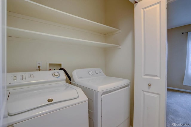 clothes washing area with carpet floors, laundry area, and washing machine and dryer