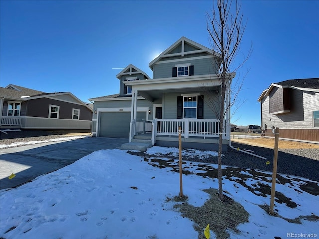 view of front facade with a garage and a porch