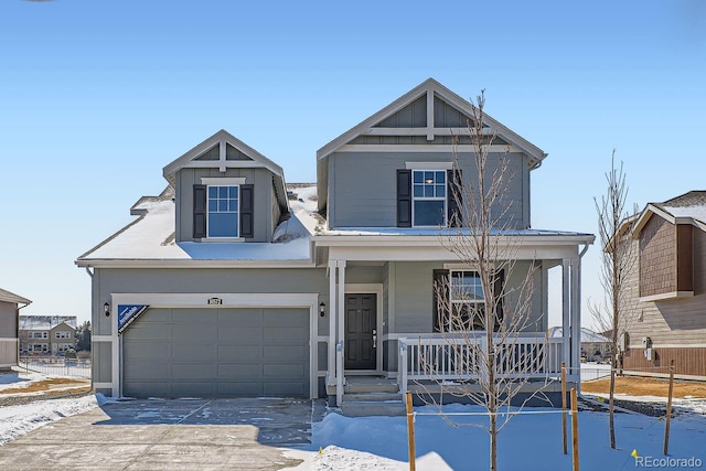 view of front facade featuring covered porch, concrete driveway, and a garage