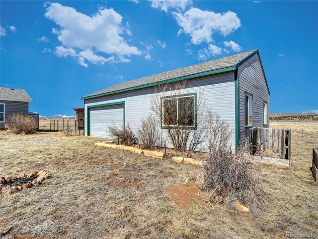 view of side of property with fence