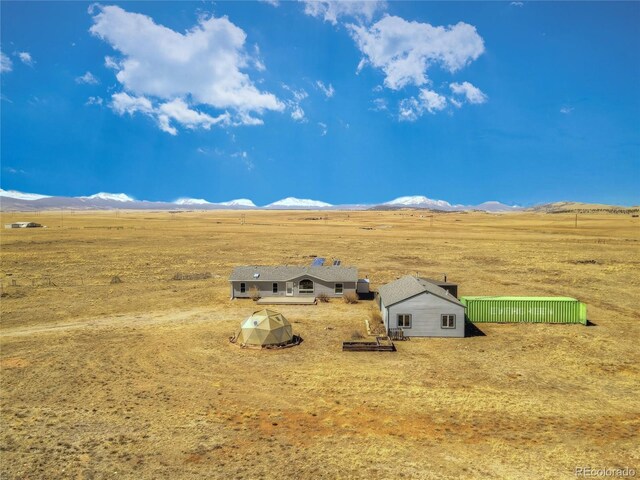 aerial view with a mountain view and a rural view