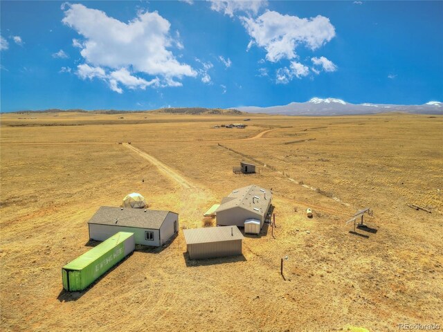 birds eye view of property featuring a rural view