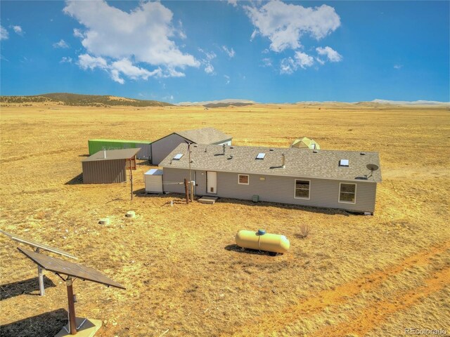 aerial view featuring a mountain view and a rural view