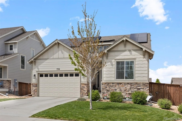 craftsman inspired home with stone siding, board and batten siding, concrete driveway, solar panels, and a garage